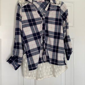 Plaid button up shirt.